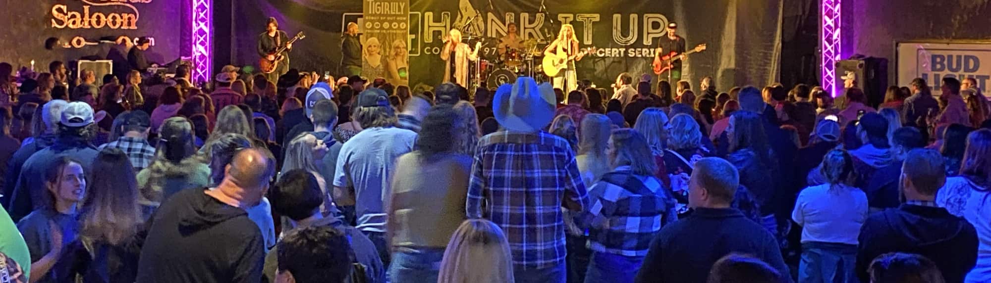 country concert with fans wearing cowboy hats Birmingham